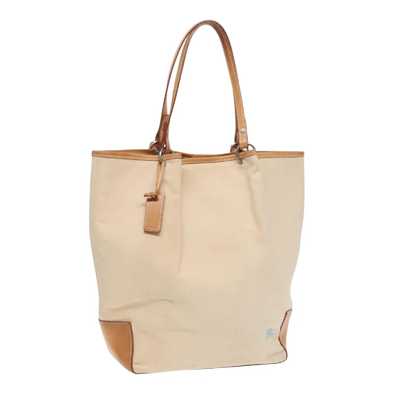 Oversized Jute Tote Bag in Natural Color with Rope Handles for a Beach VacationMonogrammed Tote Bag in Brown Leather with Personalized Initials for a Custom and Elegant TouchBurberry blue Label  Canvas Tote Bag (Pre-Owned)