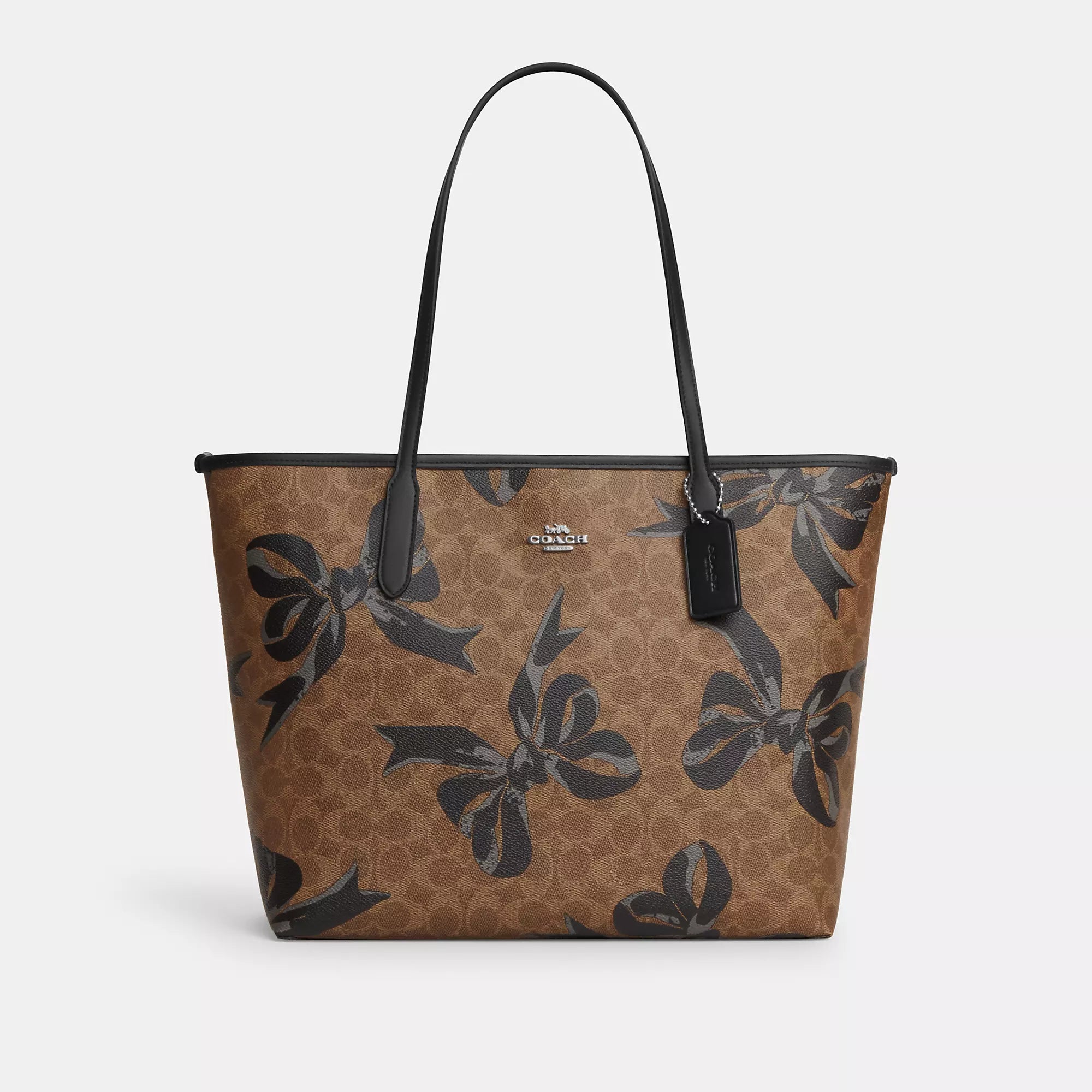 Quilted Tote Bag in Cream with Silver Hardware for a Classic and Sophisticated StyleTote Bag with RFID - Blocking Pocket in Black for Protecting Your Cards and InformationCoach Outlet City Tote Bag In Signature Canvas With Bow Print