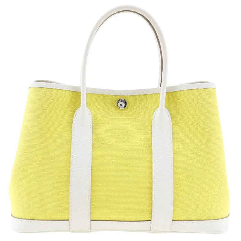 Women's Tote Bag with Detachable Pouch in Purple for Added ConvenienceWaterproof Tote Bag in Yellow for Outdoor Activities in Wet WeatherHermès Garden Party  Canvas Tote Bag (Pre-Owned)