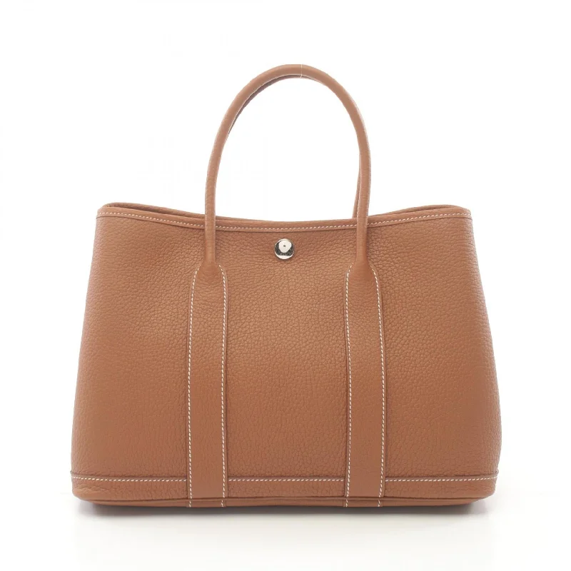 Small Vegan Leather Tote Bag in Blush Pink with Gold - Tone Hardware for a Feminine and Stylish AccessoryMonogrammed Tote Bag in Brown Leather with Personalized Initials for a Custom and Elegant TouchHermes Garden Party TPM Tote Bag Brown Small Vegan Leather Tote Bag in Blush Pink with Gold - Tone Hardware for a Feminine and Stylish AccessoryMonogrammed Tote Bag in Brown Leather with Personalized Initials for a Custom and Elegant TouchHermes Garden Party TPM Tote Bag Brown