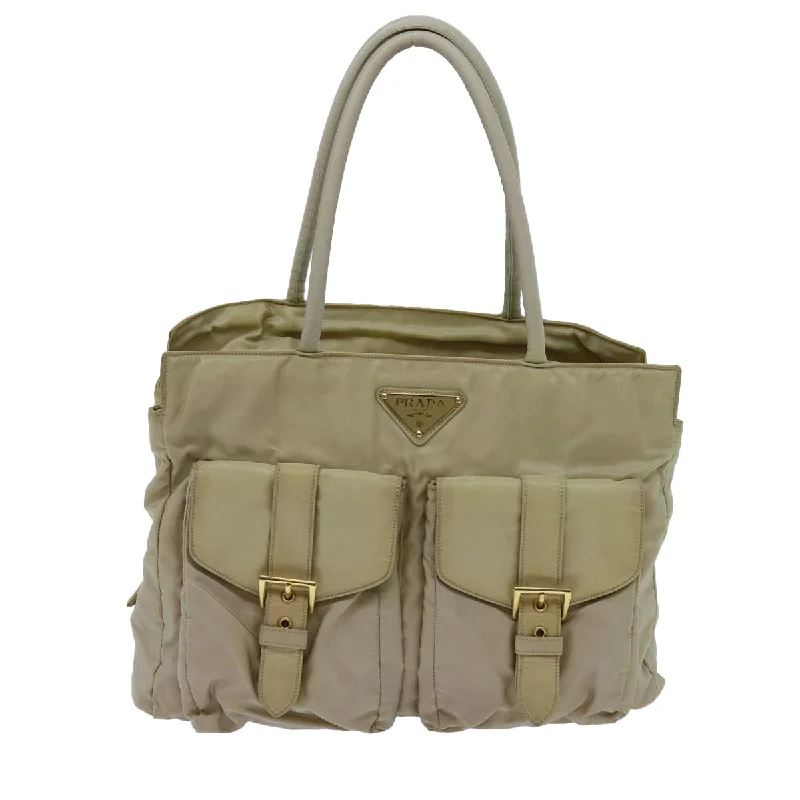 Small Vegan Leather Tote Bag in Blush Pink with Gold - Tone Hardware for a Feminine and Stylish AccessoryOversized Jute Tote Bag in Natural Color with Rope Handles for a Beach VacationPrada Tessuto  Canvas Tote Bag (Pre-Owned)
