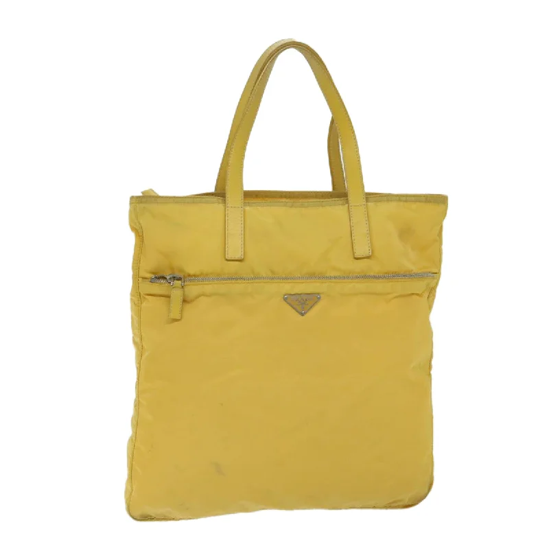 Linen Tote Bag in Natural Beige with Braided Details for a Rustic Summer EnsembleGeometric - Printed Tote Bag in Multicolor for a Contemporary and Trendy OutfitPrada Tessuto  Synthetic Tote Bag (Pre-Owned)