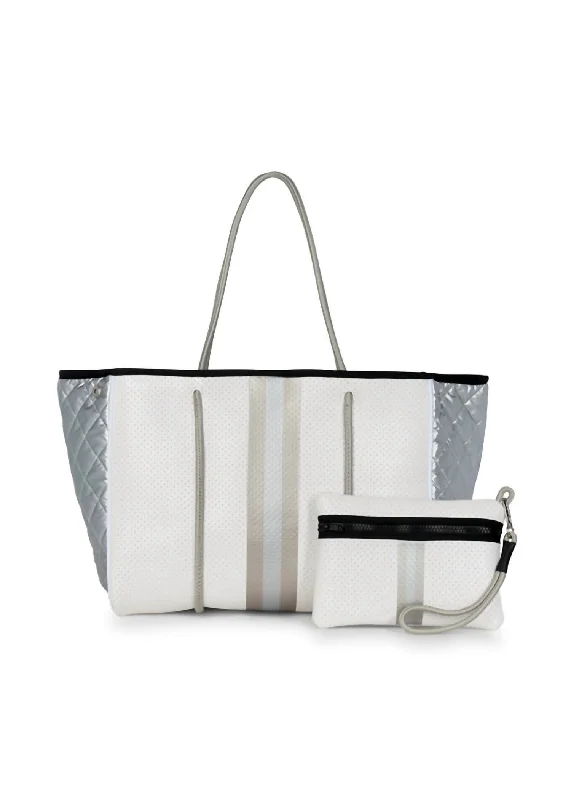 Quilted Tote Bag in Cream with Silver Hardware for a Classic and Sophisticated StyleWomen's Tote Bag with Detachable Pouch in Purple for Added ConvenienceWomen's Greyson Vapor Tote Bag In White Leatherette